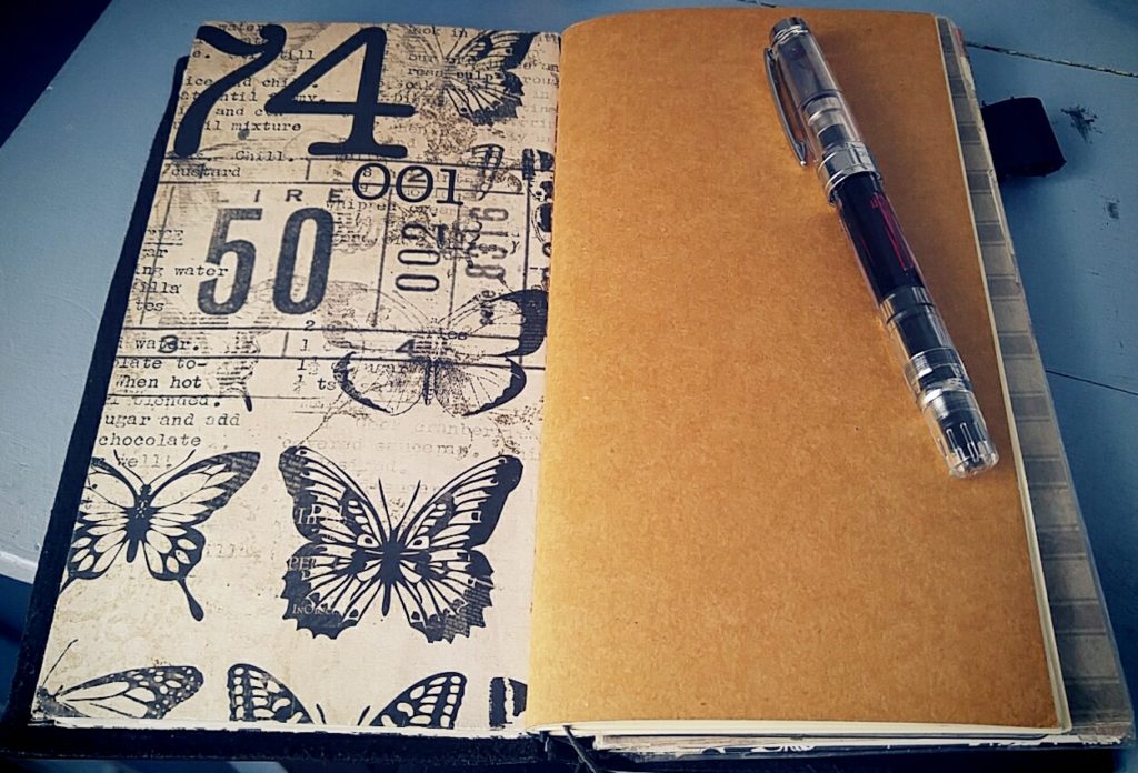 Writing journal (right) and my writer's notebook (left) in my Midori TN